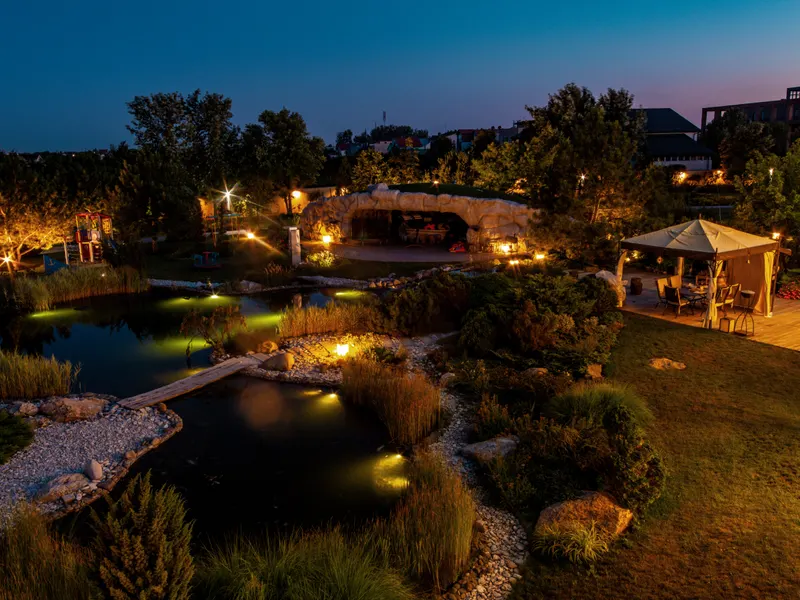 Warm landscape lighting installation on a Novato home at dusk